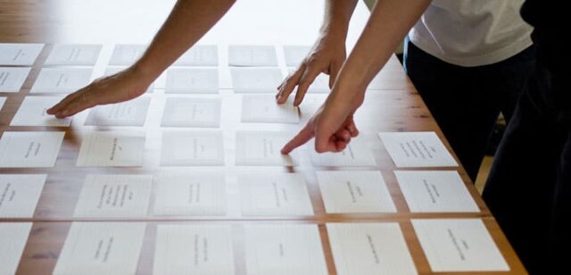 People sorting cards People sorting cards